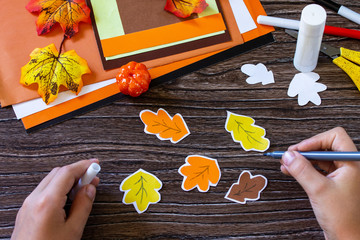 Instructions, step 6. Greeting card for Thanksgiving on a wooden table. Childrens art project, handmade, crafts for children.