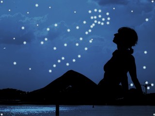 silhouette of a girl on a background of the starry sky