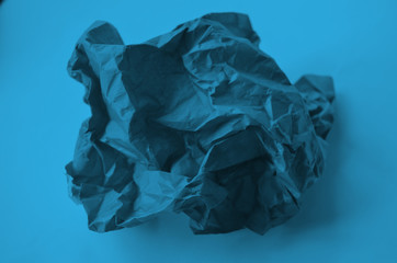 Abstract image. Abstraction. Crumpled paper on blue background