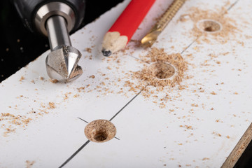 Metal countersink for making holes for screws. Minor jobs in the carpentry workshop.
