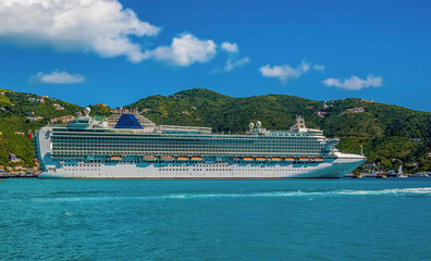 Fototapeta na wymiar A cruise liner moored at the terminal in Road Town on the main island of Tortola