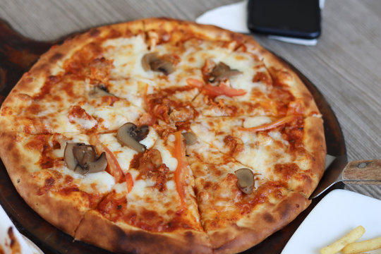 Pizza. Selective focus on pizza. Image sightly blur.