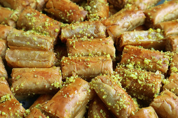 Baklava Pastries Topped with Chopped Pistachio Nuts Beautifully Displayed on a Tray