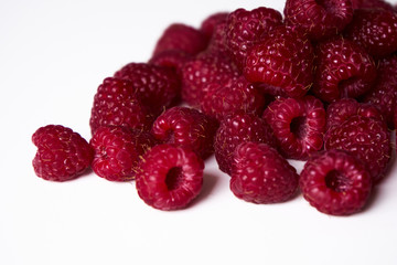 Raspberry on a white background, close-up