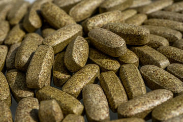 Dietary supplement pills. Herbal drug an alternative medicine. Macro close-up