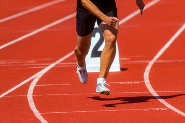 Athletics man running on the track field