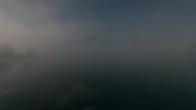Mountains and lake time-lapse shot. Early morning sunrise before a hot summer day in Bavaria Germany.
