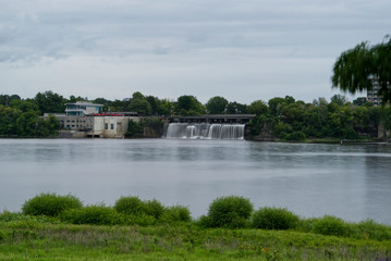 Obraz premium A waterfalls falling into a river