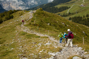 Hikers on a typical section of the Eiger trail, Switzerland.
