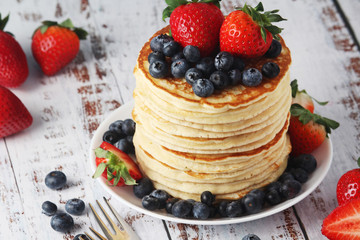 A stack if home-made pancakes with berry