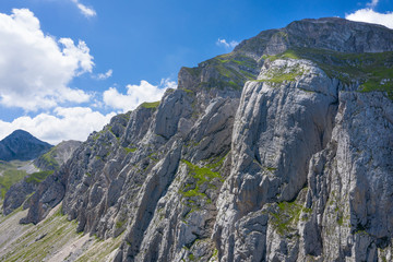 Fototapeta na wymiar aerial view of a vertical rocky wall in the mountain area of gran sasso italy abruzzo