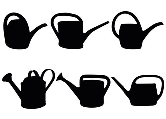 Watering cans for watering flowers and gardens. © Наталья Выгузова