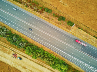 Aerial drone view of beautiful French countryside and six-lane motorway