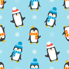 Seamless pattern with penguins isolated on blue background.