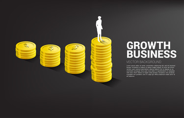 Silhouette of businessman standing on top of growth graph with stack of coin. Concept of success investment and growth in business