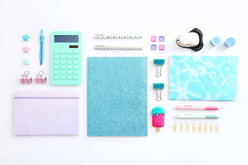 Flat lay of stationery on white background, copy space