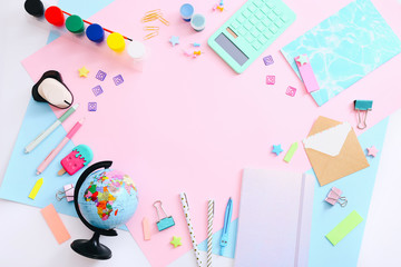 Flat lay of stationery on pink background