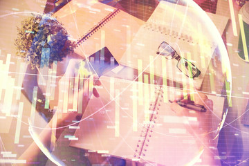 Fototapeta na wymiar Multi exposure of woman on-line shopping holding a credit card and financial theme drawing. Business E-commerce concept.