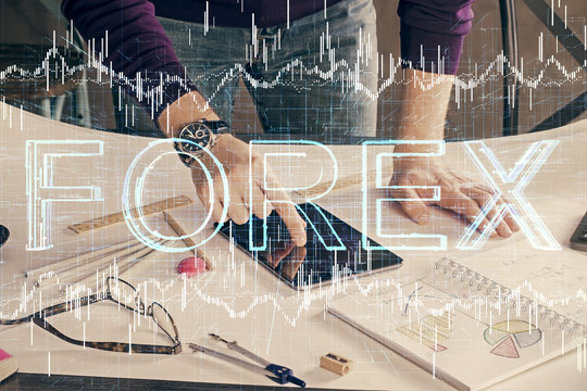 Double exposure of man's hands holding and using a digital device and forex graph drawing. Financial market concept. - Powered by Adobe