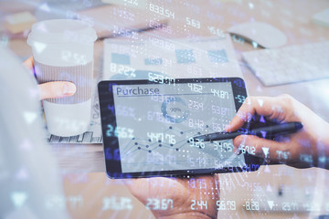 Double exposure of man's hands holding and using a phone and financial chart drawing. Market analysis concept.