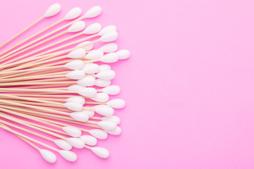 Top view cotton bud for cleaning the ears on pink