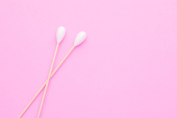 Top view cotton bud for cleaning the ears on pink