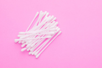 Top view cotton bud for cleaning the ears on pink