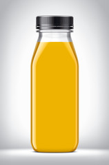 Plastic Bottle with oranges Juice on background. 