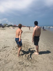 Boys playing horseshoes