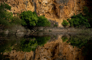 Reflection of an eroded wall in the lake water.