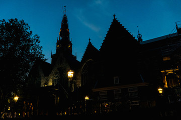Fototapeta premium Night Silhouette of a Church in the Canal District of Amsterdam