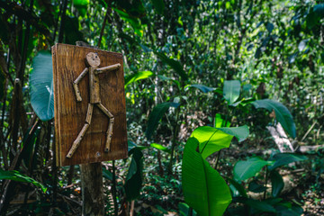 Handmade Sign of a Man Pointing Down the Trail in the Cloud Forest of Peru
