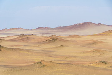 Fototapeta na wymiar Vast Arid Dunes of the Ica Desert in Peru