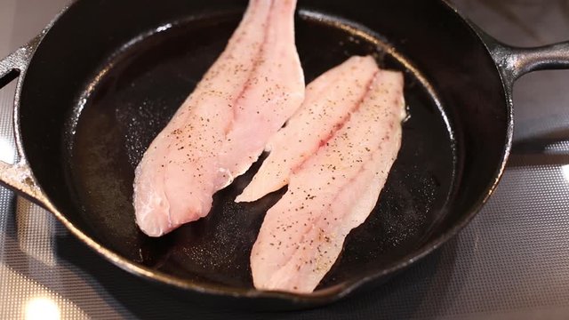 Fry Cooking Red Fish White Meat on Cast Iron skillet video
