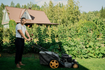 man mowing grass