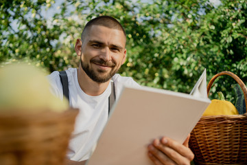 man with a basket of apples