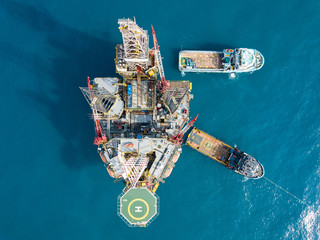 Aerial view offshore jack up rig at the offshore location during sunset