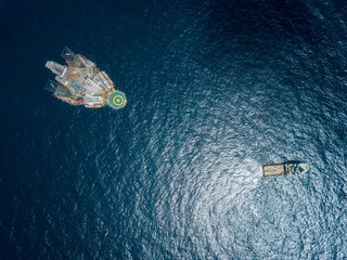 Aerial view offshore jack up rig at the offshore location, view from a drone