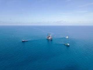 Offshore jack up rig and tow vessels during the rig move operation at the offshore location