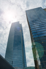 Fototapeta na wymiar Tall modern high-rise commercial buildings rising skyward