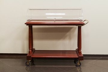 Luxury wooden trolley, two shelves with semi-cylindrical dome, swivel castors