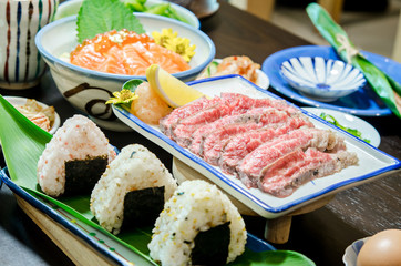 Sliced grilled Strip Loin rare degree of ripeness beef steak served.