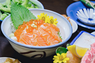 Salmon sashimi with salmon's egg (Ikura) in bowl.