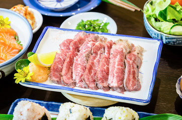 Sliced grilled Strip Loin rare degree of ripeness beef steak served.