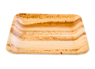 Plate made from dried betel nut leaf palm, natural material isolated on white background.