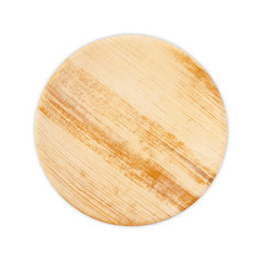 Plate made from dried betel nut leaf palm, natural material isolated on white background.