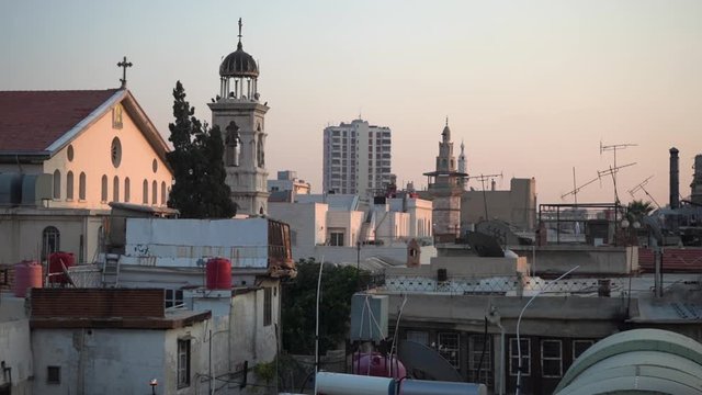 Morning Cityscape of Damascus Syria, Orthodox Christian Church Tower and Minaret of Mosque in Background