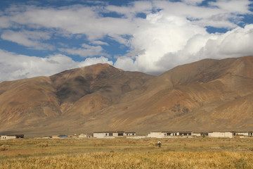 View of the mountains and Tibetan village on the way to Everest Base Camp, Tibet, China