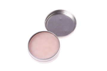 Pink color balm cream isolated on background