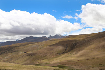 View of the mountains and dramatic sky near Tingri on the way to Everest Base Camp, Tibet, China